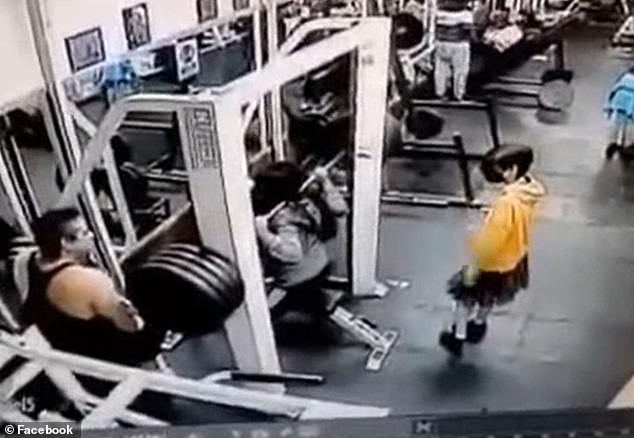 The 42-year-old woman tries to lift the 400-pound barbell moments before losing control of it