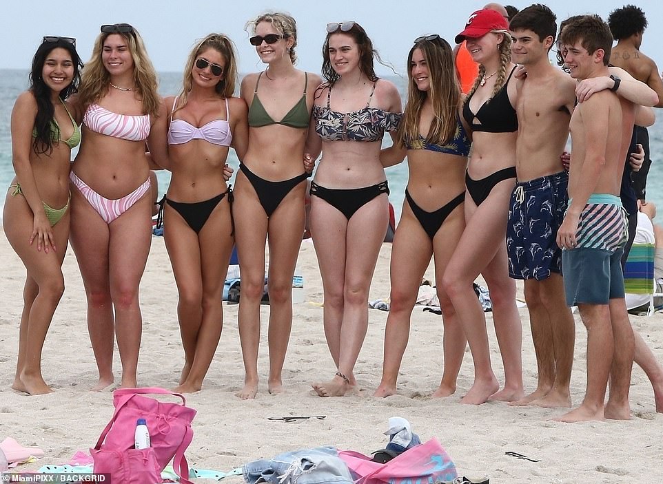 Beach bodies abound in Miami Beach.  Here, several students line up for a group photo to let everyone at home eat their heart out.