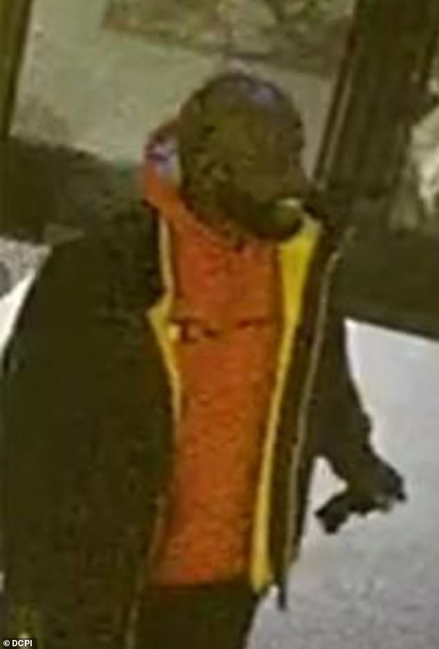 The suspect (pictured) is described as male, dark complexion, around 40 to 50 years old, heavily built, balding and was last seen wearing a red Champion hoodie, black jacket, black pants and black sneakers