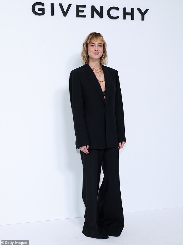 Chic: She was joined by Nora Arnezeder, who she complemented in a very similar black suit.  She opted for an oversized blazer and flared trousers, including a bra