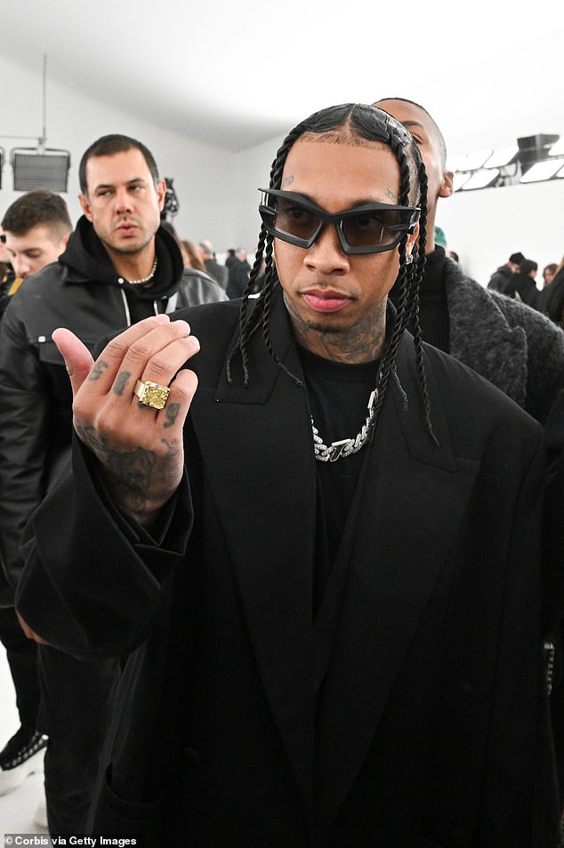 Looking good: Tyga also attended the runway show wearing an oversized black jacket and matching black t-shirt
