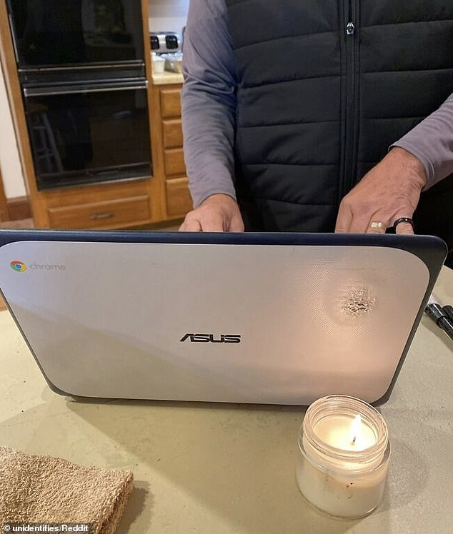 This dad was confused as to why the top-left corner of his screen was blurry, only to realize a candle had been strapped to the back of the laptop