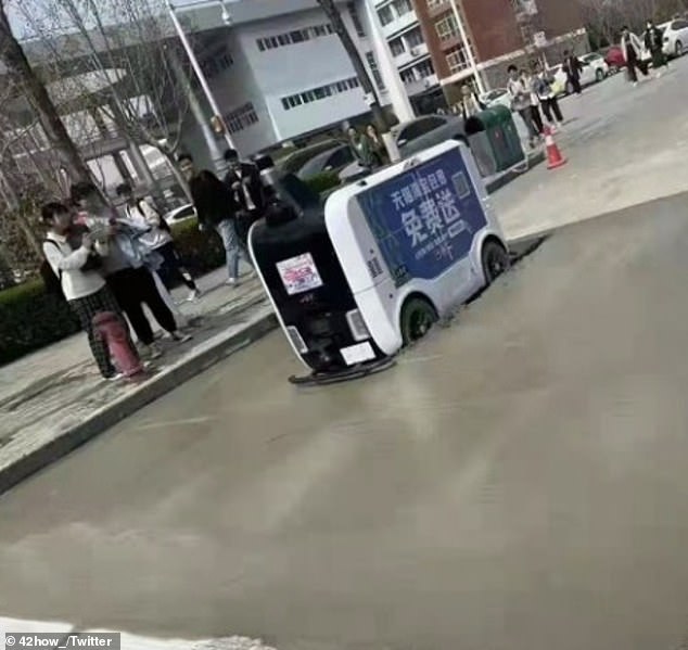 Computer Says No: An unmanned delivery robot in China drove into wet cement and got stuck while delivering food