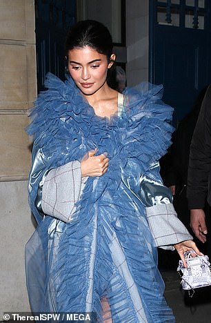 She rocked the intricately designed powder blue outer layer over a mini dress