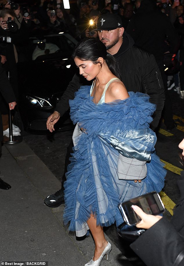 Protective: Jenner was escorted by security guards who made sure she was safe as a crowd gathered around her