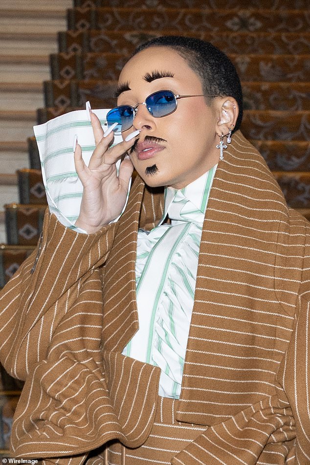 Interesting: Doja bleached her eyebrows and added a fake mustache to her Inspector Gadget look