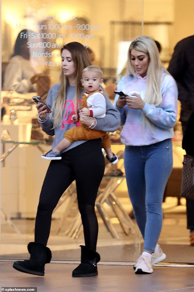 Sighting: Aaron Carter's on-off fiancée Melanie Martin (R) took her son Prince out for a day of shopping in LA on Monday - a day after she claimed the late singer suffered a drug overdose and didn't drown in his bathroom