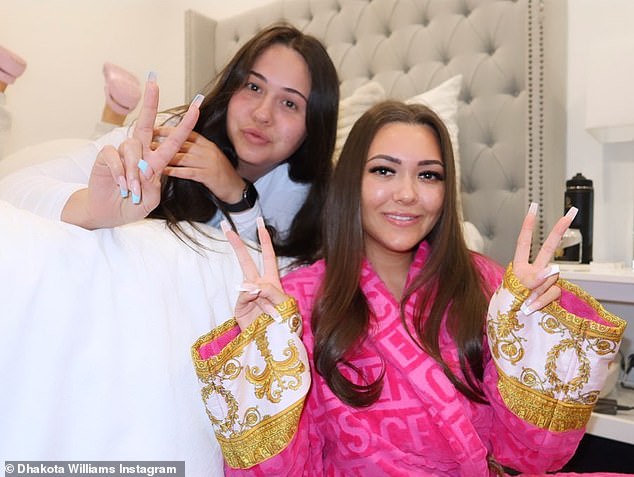 Dhakota Williams makes a mint by OnlyFans.  The 21-year-old proved she likes to spend big on Thursday as she posed in her bedroom in a Versace bathrobe, which retails for $750