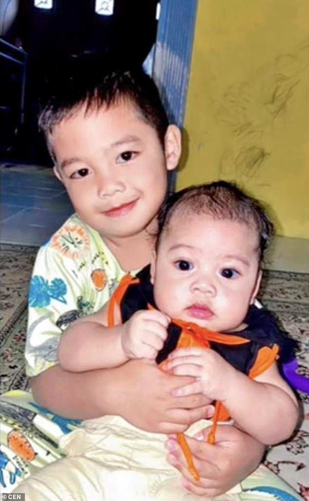 The boy - known locally as Muhammad Ziyad Wijaya (left) - had disappeared two days earlier near the Jawa estuary in East Kalimantan province