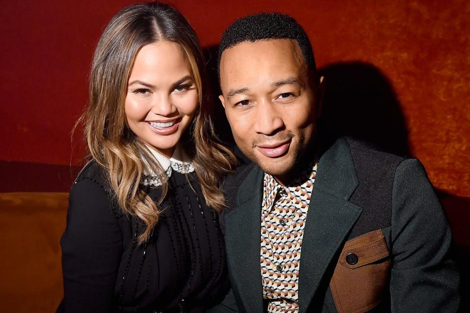PARIS, FRANCE - OCTOBER 3: Chrissy Teigen and John Legend attend the Miu Miu aftershow party as part of Paris Fashion Week Womenswear Spring/Summer 2018 at Boum Boum on October 3, 2017 in Paris, France.  (Photo by Victor Boyko/Getty Images)