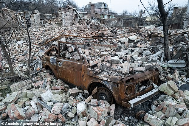 A damaged car and a pile of debris are seen as the Russo-Ukrainian war rages on January 28, 2023 in Bakhmut, Ukraine