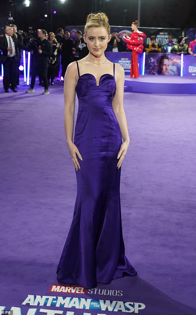 Glamorous look: She wowed in the purple dress as she drew attention