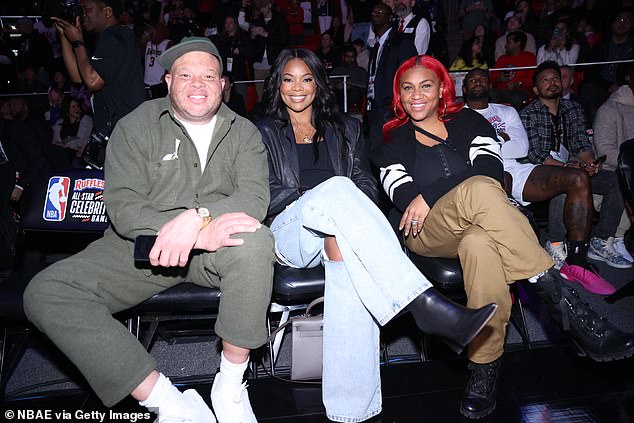 Supportive: Wade's wife Gabrielle Union (centre) watched as her husband played at the late-night event