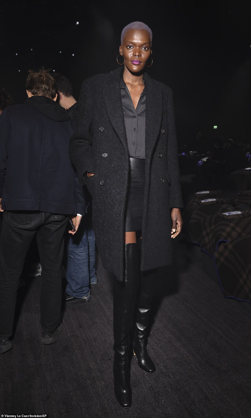 Unbelievable: Sheila Atim looked her best in a pair of knee-high leather boots and a matching mini skirt while she wrapped up in a long coat