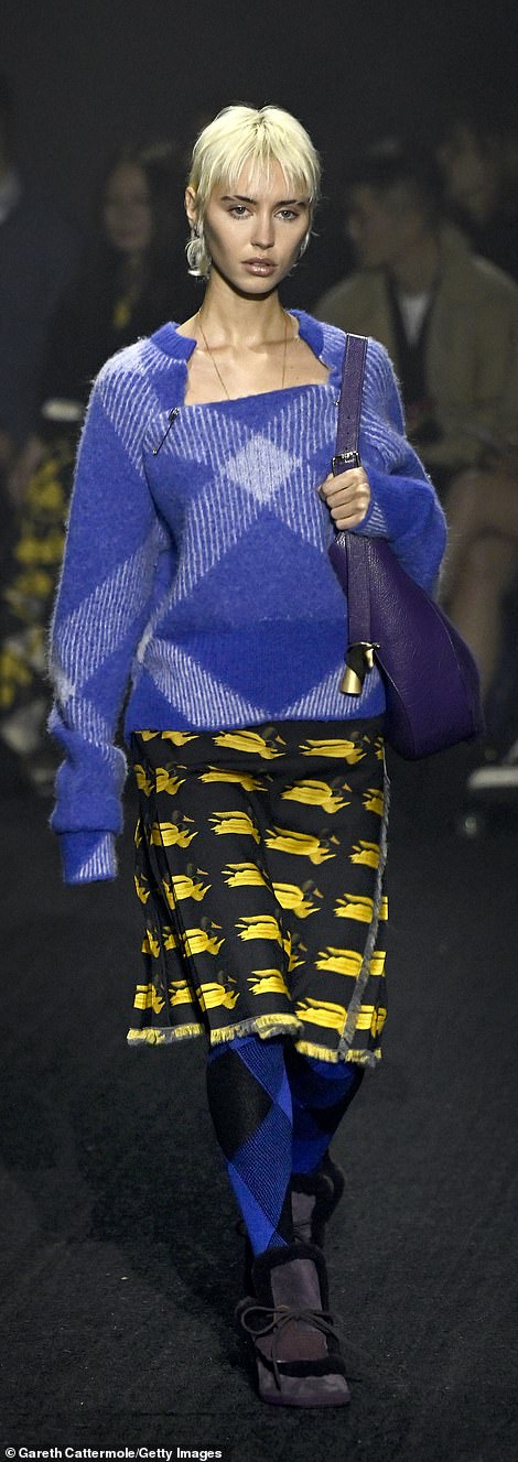 Bold look: Iris Law exuded confidence in a blue knit sweater teamed with a yellow and black skirt as she showcased her wardrobe on the runway